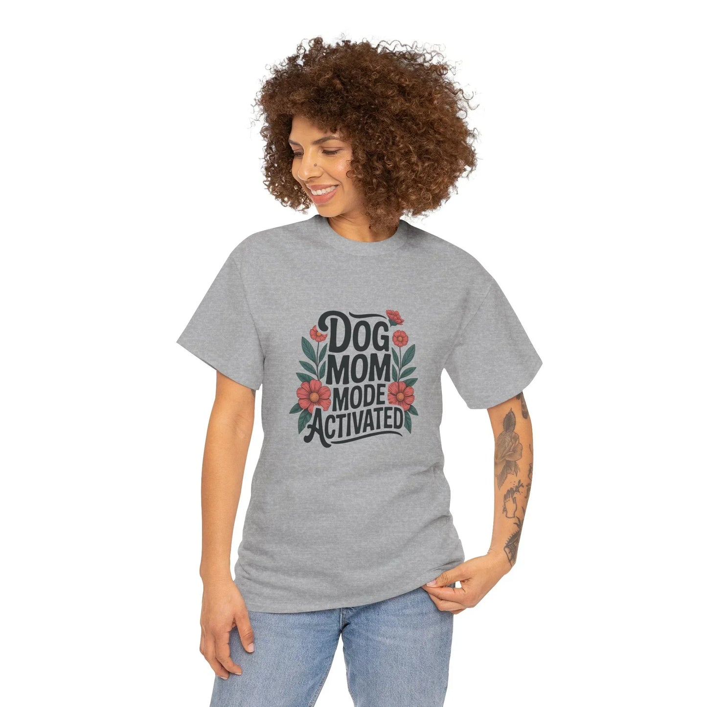 Woman wearing gray Dog Mom Mode Activated t-shirt with floral design, smiling